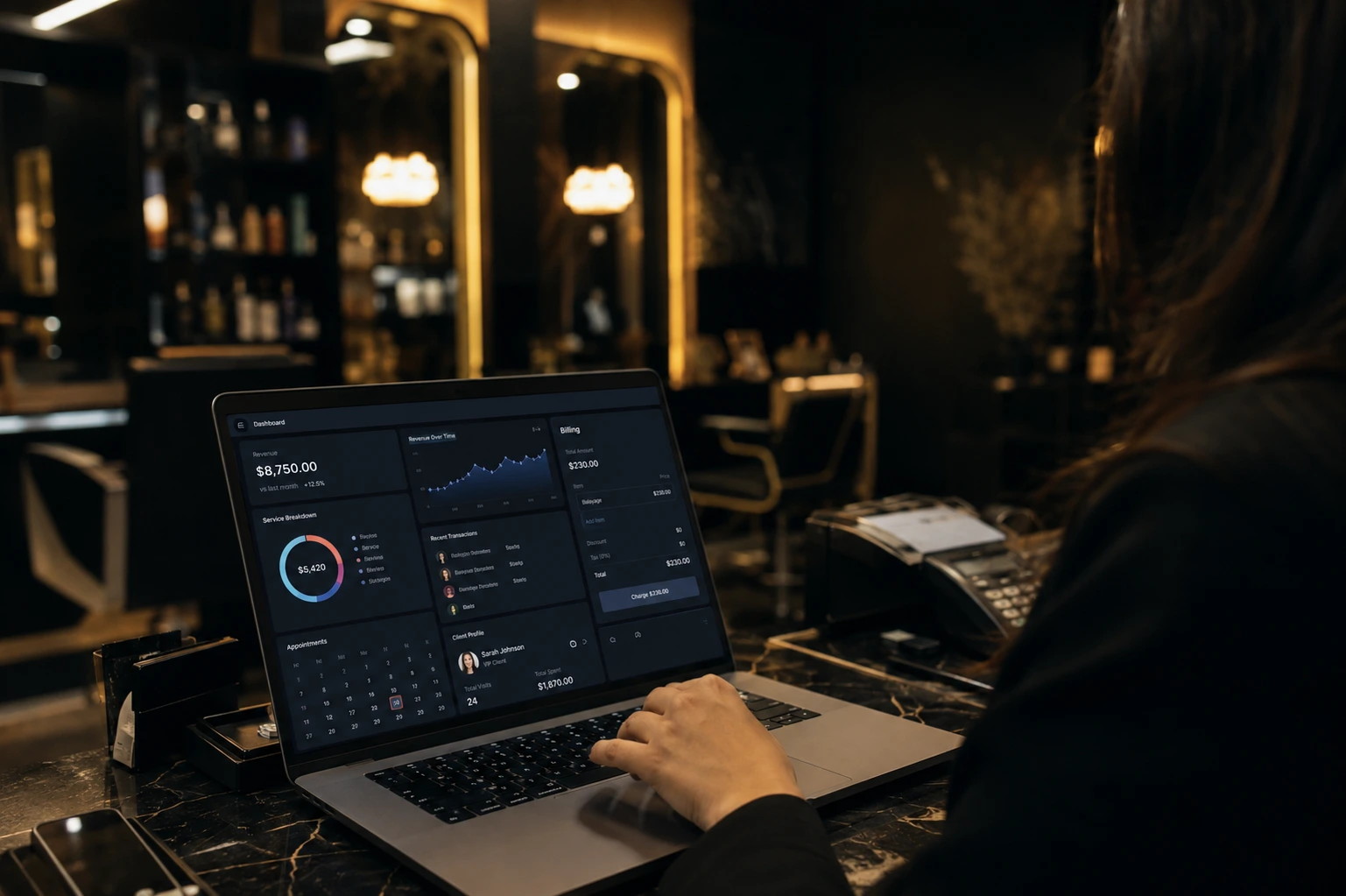 Salon front desk with a dashboard showing billing and revenue on a salon management system